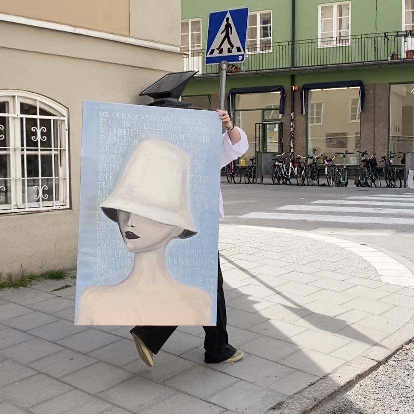 Painting of a person with a hat in a city setting