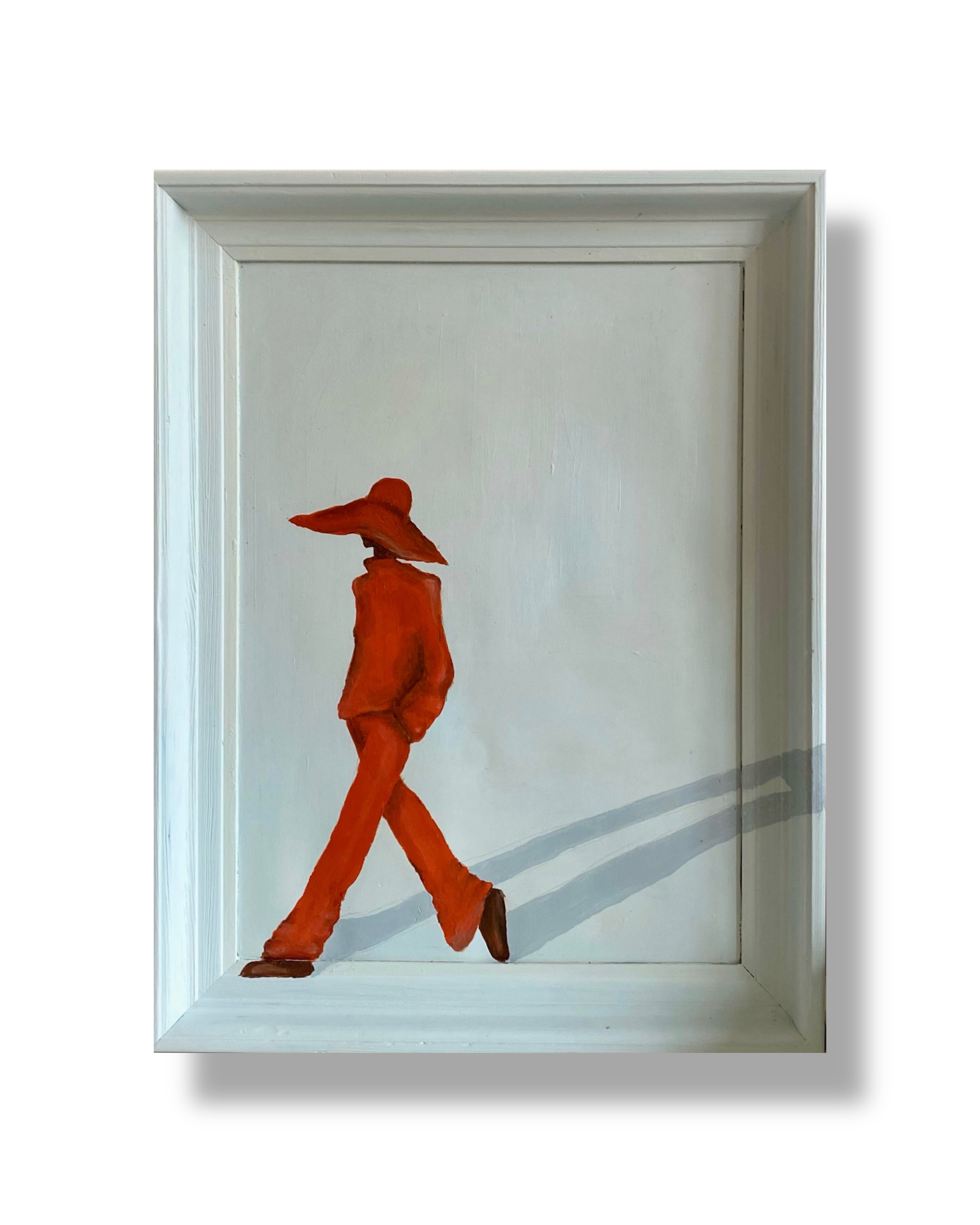 Silhouette of a person in red walking